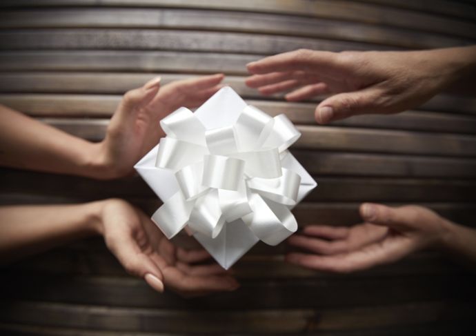 459273209 Hands Exchanging Present