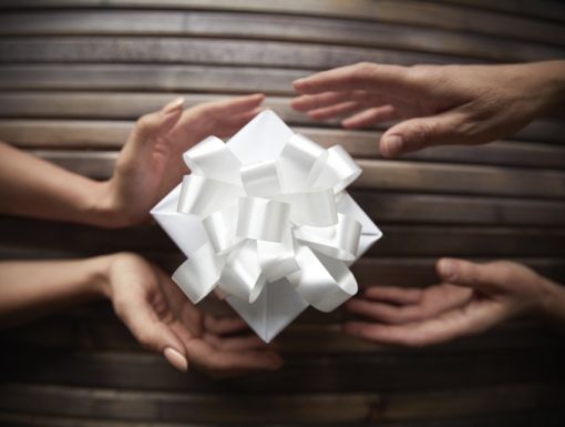 459273209 Hands Exchanging Present