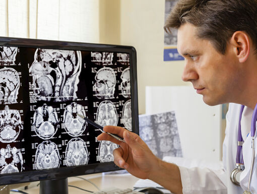 187489411 Doctor Examining Mri Scan Of The Brain