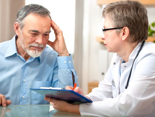 man speaking with doctor about lung cancer screening