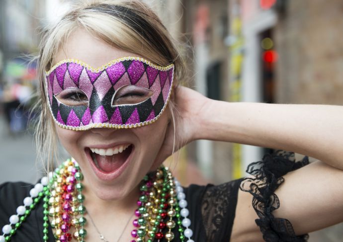 Picture of a woman wearing a Mardi Gras mask