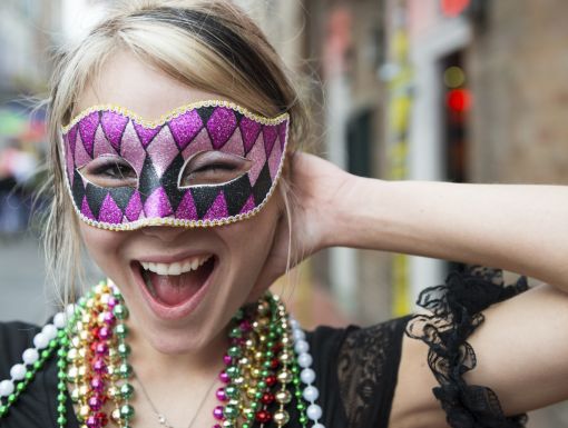 Picture of a woman wearing a Mardi Gras mask