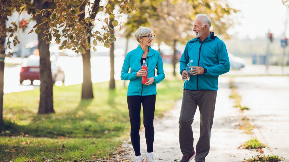 Husband and Wife transplant patients walking.