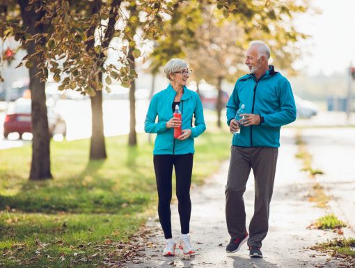 Husband and Wife transplant patients walking.
