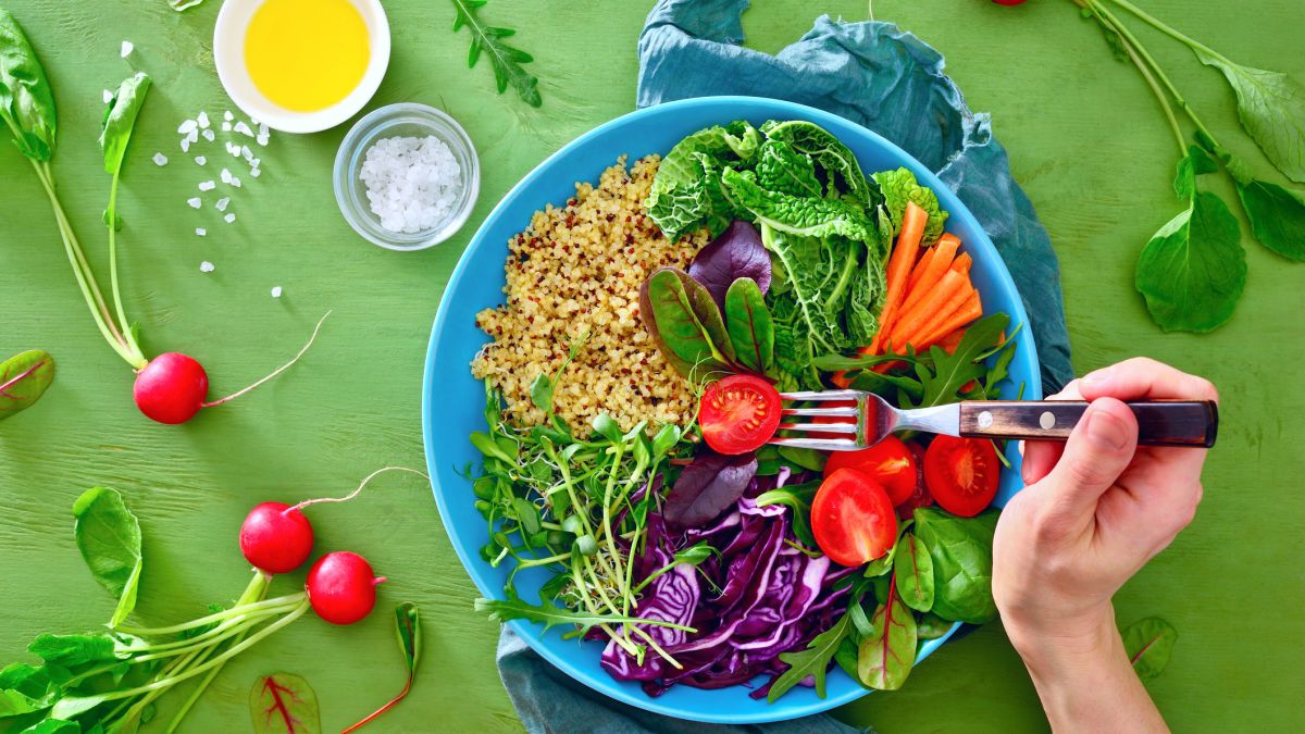 Bowl full of whole foods, including fruits and veggies