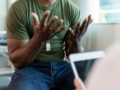 Male patient talking with doctor