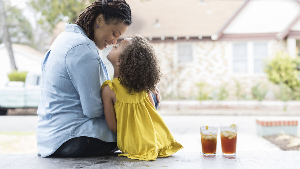 Getty Images 927892046 mom and daughter on porch