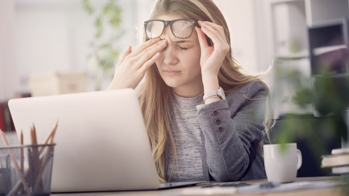 young woman with PTSD sitting at computer