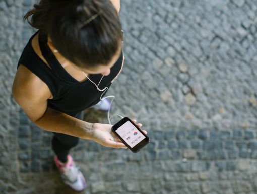 Getty Images 636043558 holding phone work out gear