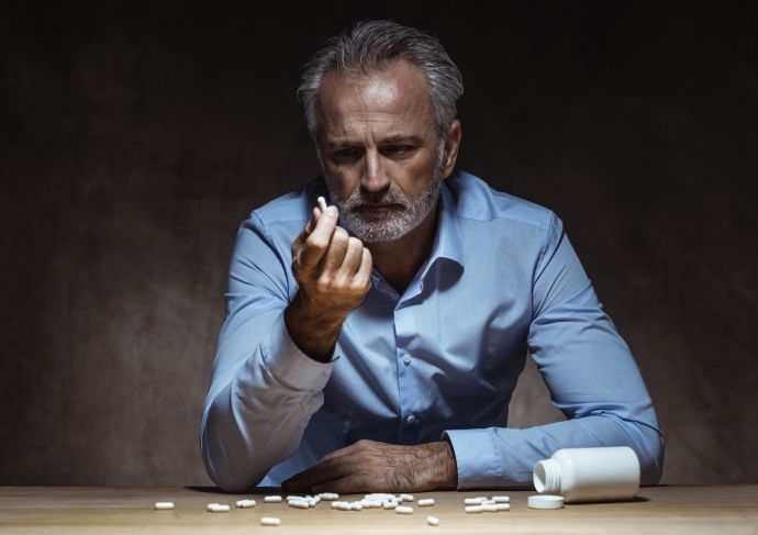 Man with drugs Getty Images 1024106306