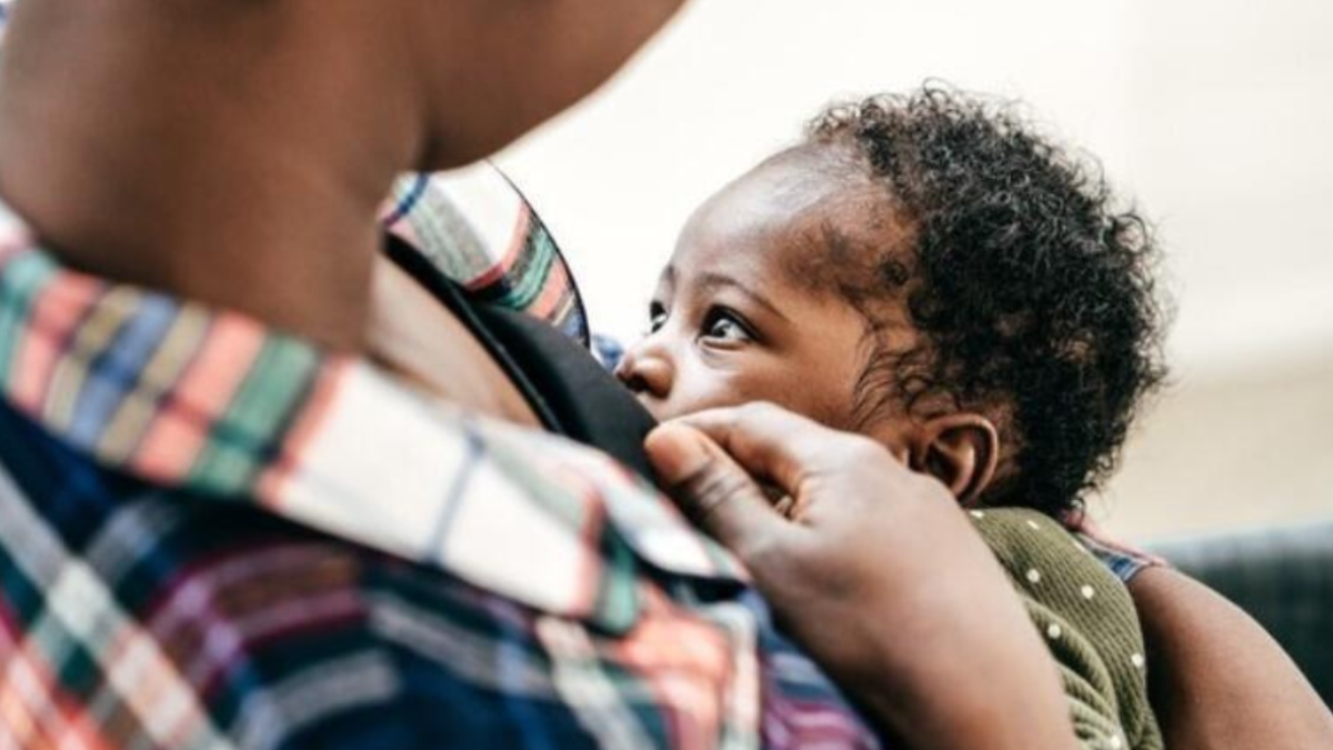 Mother with mastitis breastfeeding her baby