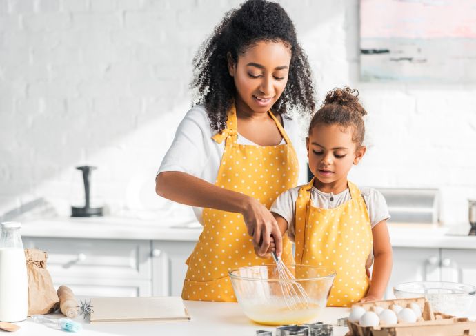 mother and daughter baking together