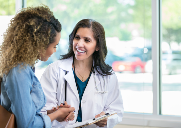 Woman talking to her OB/GYN
