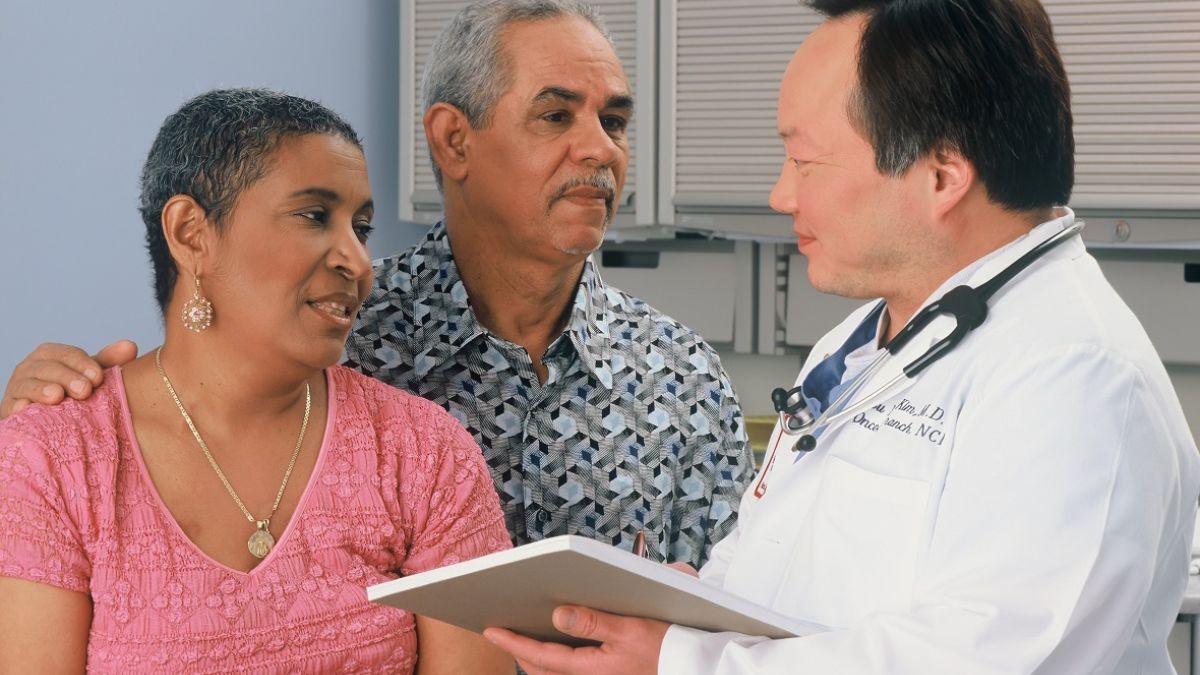 Medical consultation with couple and doctor