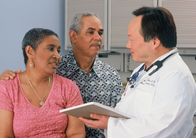 Medical consultation with couple and doctor