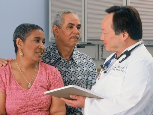 Medical consultation with couple and doctor