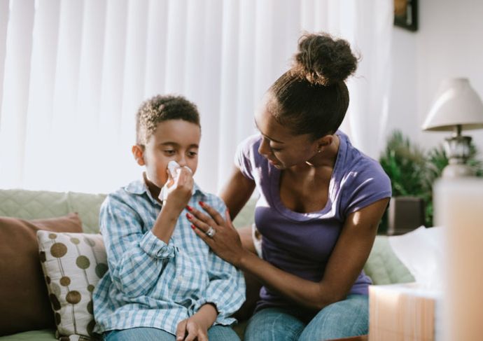 Child blowing nose