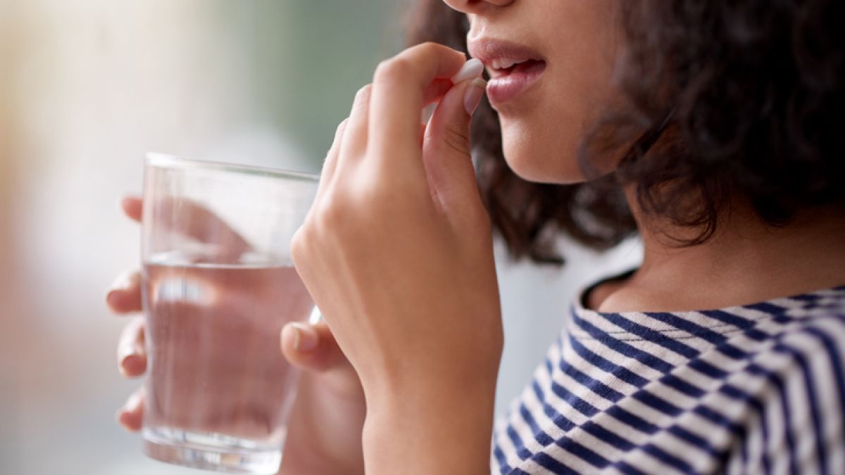 Woman taking medication