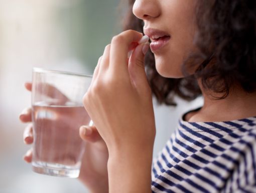 Woman taking medication