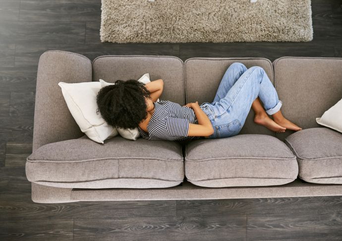 Woman suffering from food poisoning or stomach flu