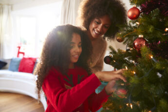 Mother and daughter decorating for the Christmas Holiday