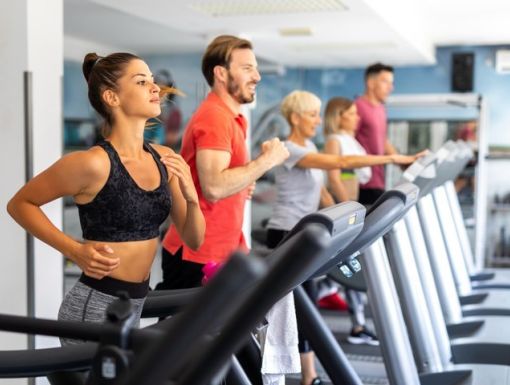 people running on treadmill at gym to get fit in the new year