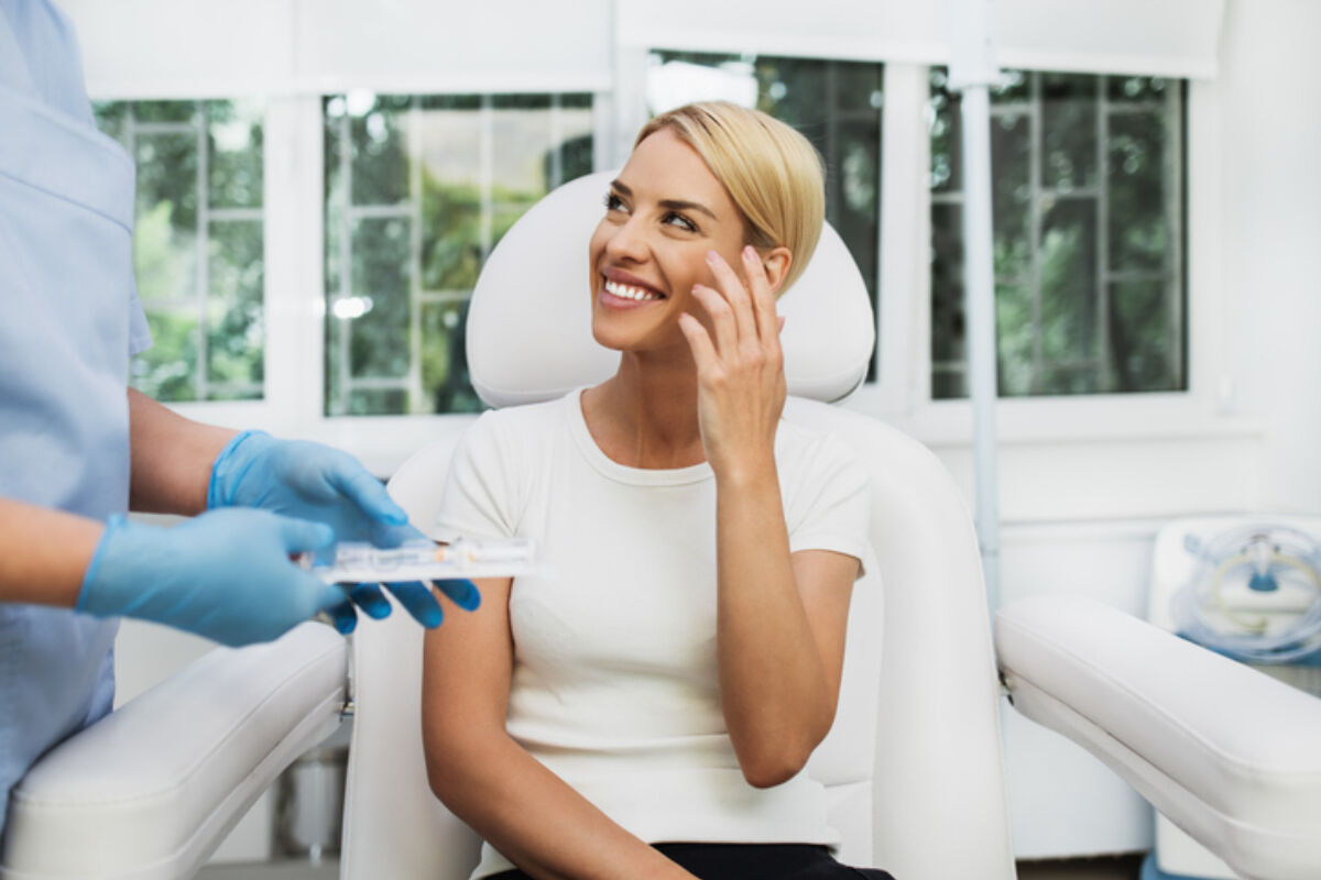 Woman discussing wrinkles with doctor