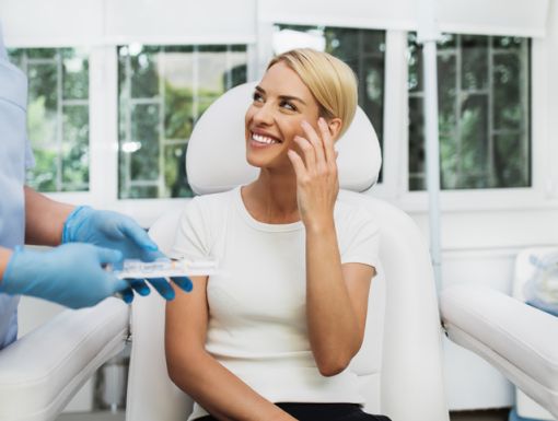 Woman discussing wrinkles with doctor