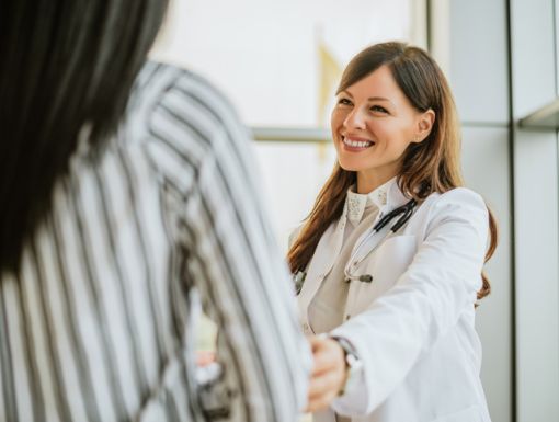 Female doctor smiling with patient