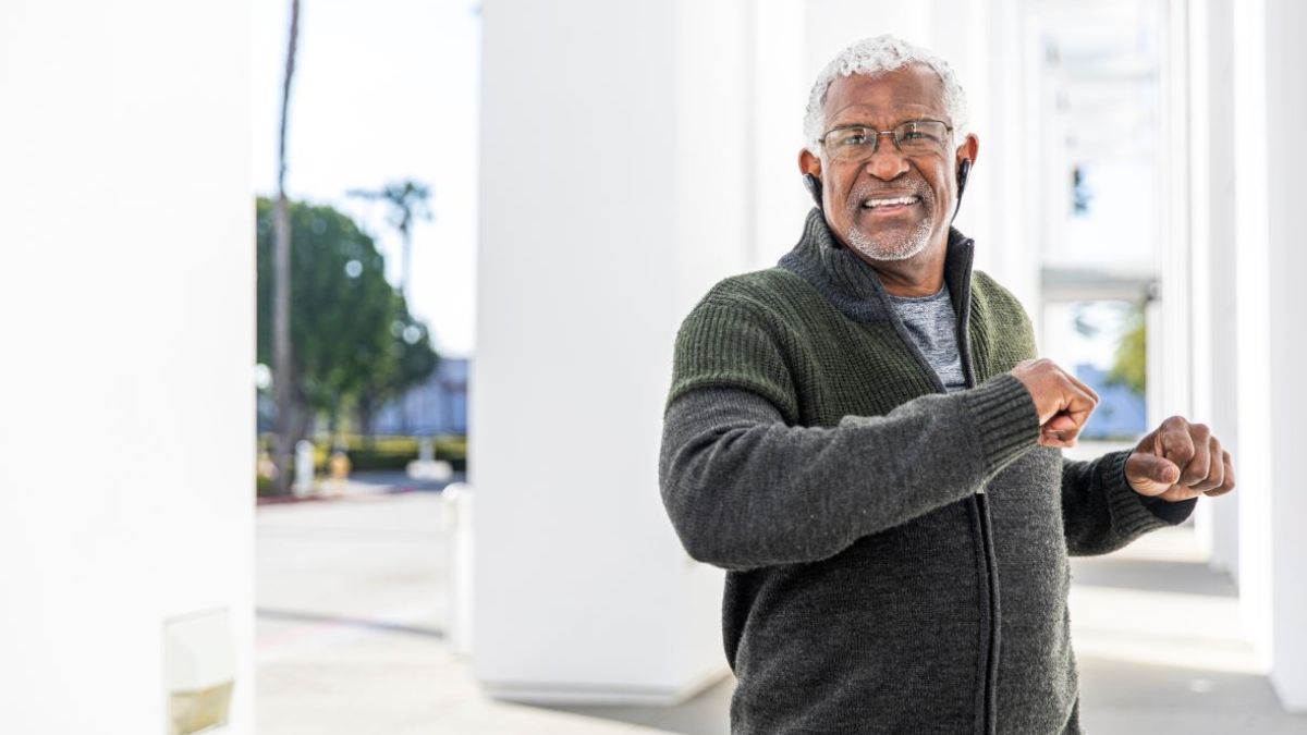 Older man preparing to exercise outdoors