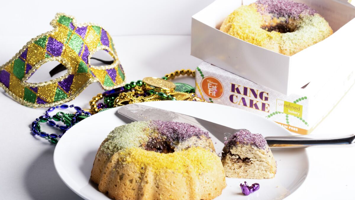 Eat Fit King Cakes next to Mardi Gras mask