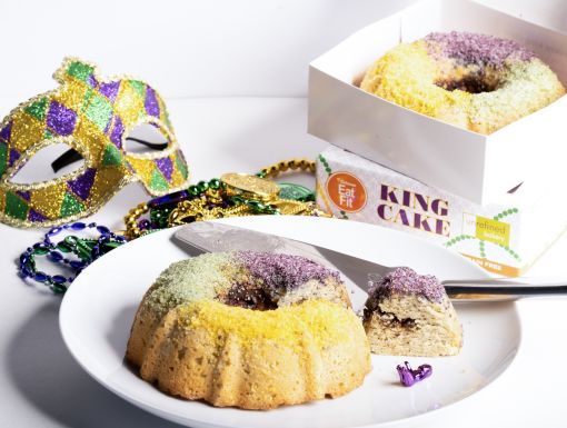 Eat Fit King Cakes next to Mardi Gras mask