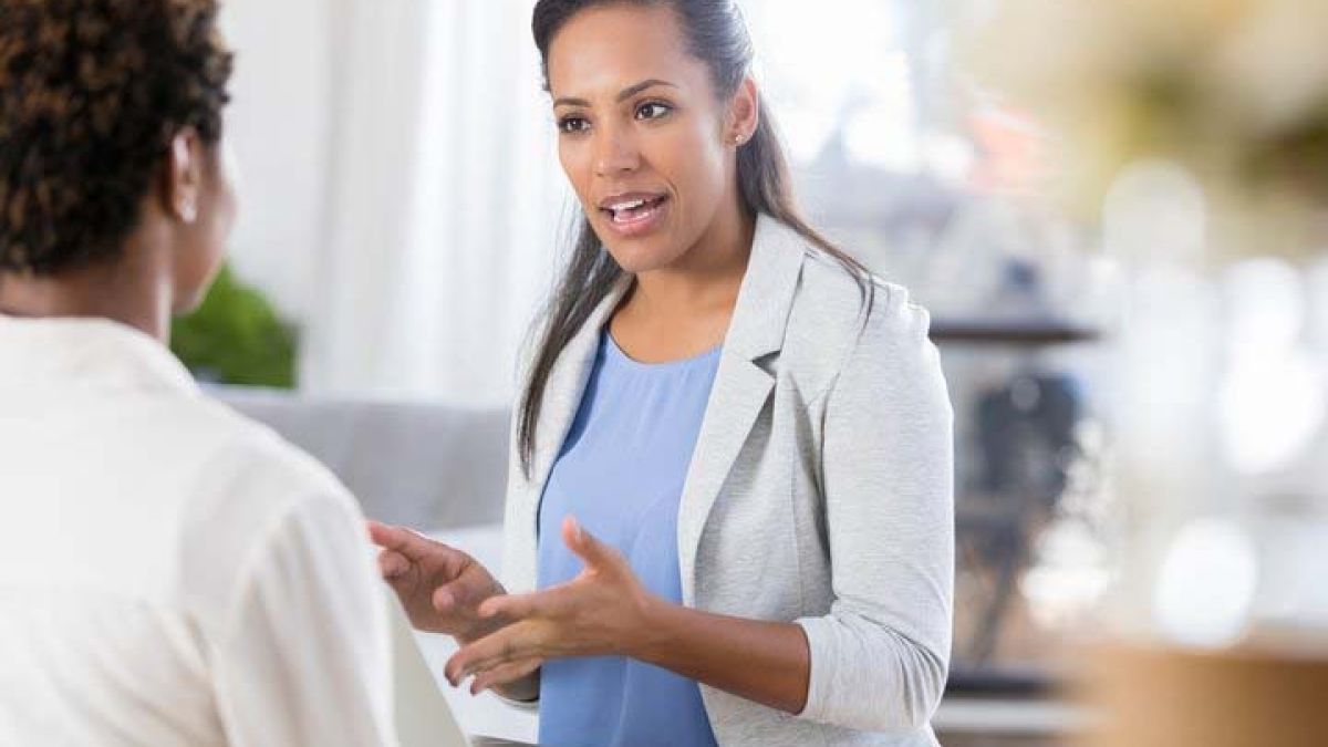 Doctor talking to woman