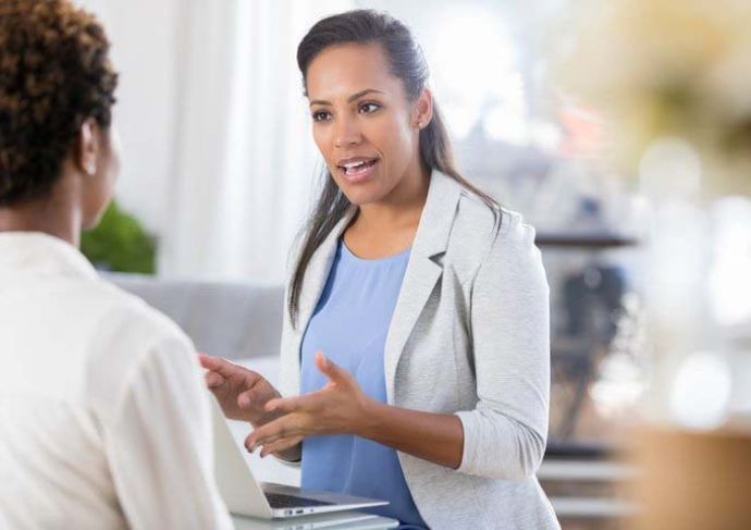 Doctor talking to woman