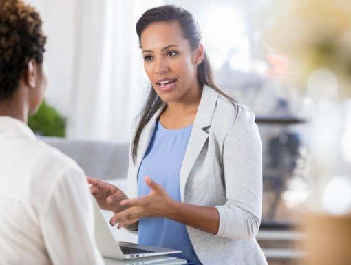 Doctor talking to woman