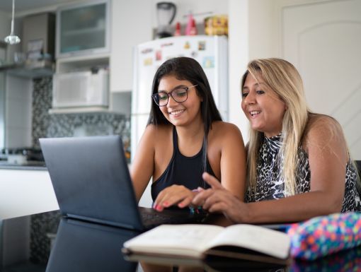 Mom and teen looking at laptop