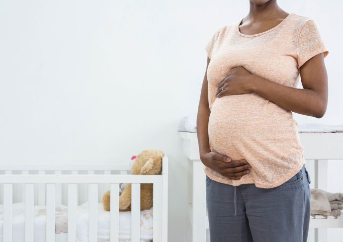 Pregnant mother holding bump