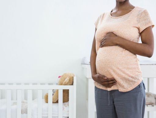 Pregnant mother holding bump