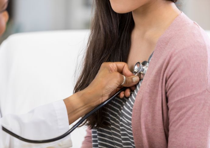 Young woman heart and stethescope