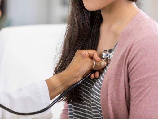 Young woman heart and stethescope