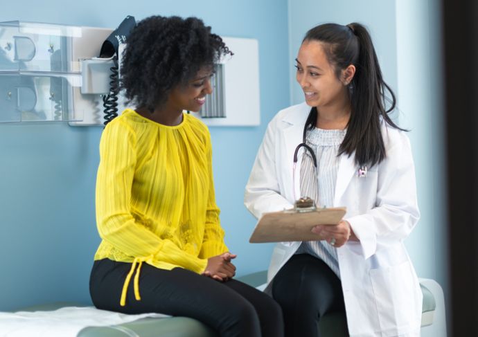Woman speaking with doctor