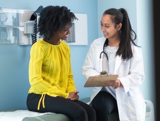 Woman speaking with doctor