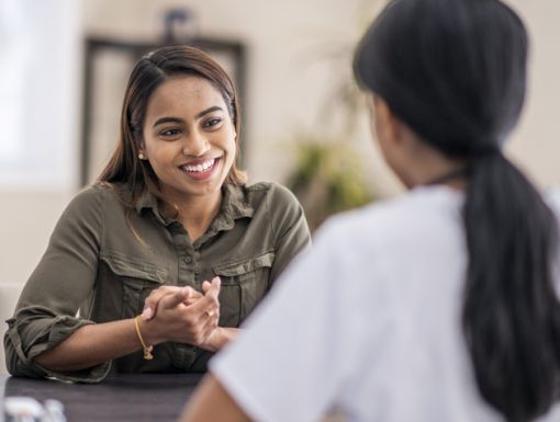 Woman talking to physcian