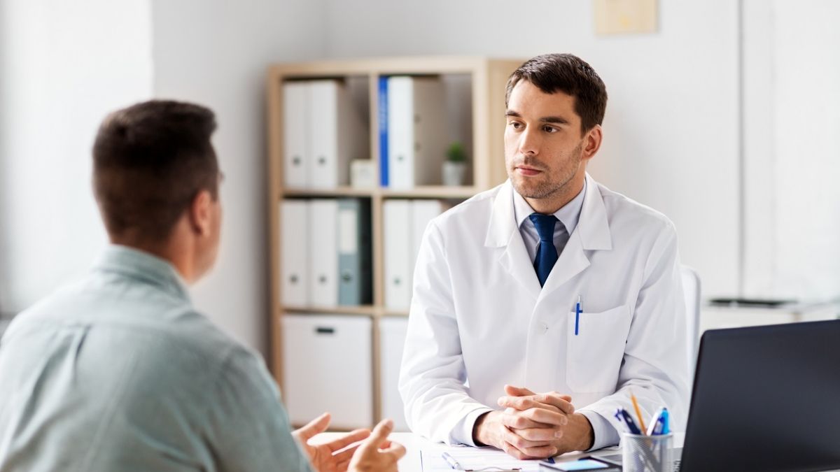 Doctor consulting Asian Young Man