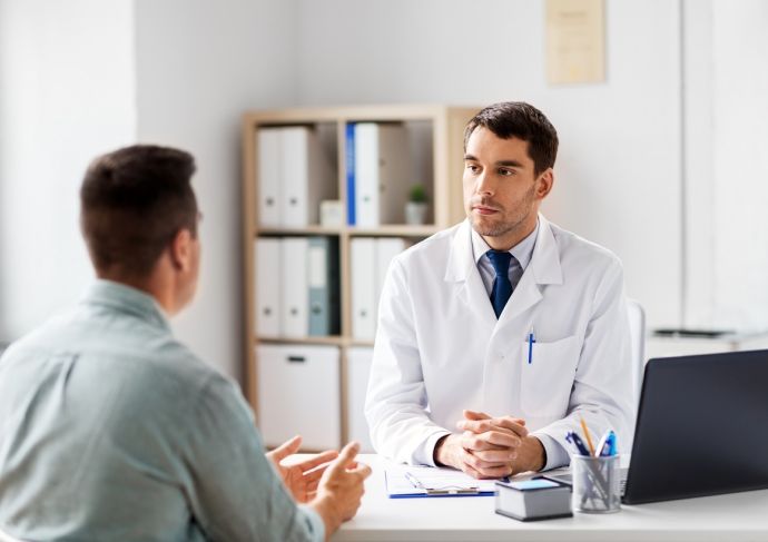 Doctor consulting Asian Young Man