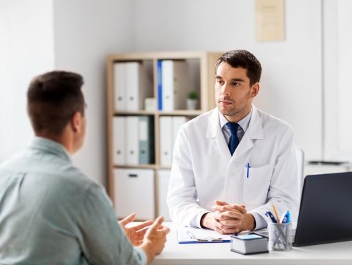 Doctor consulting Asian Young Man