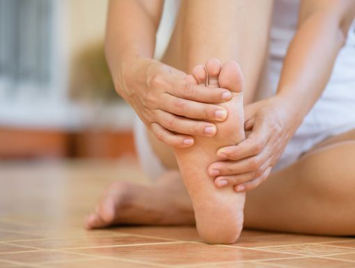 Woman holding foot