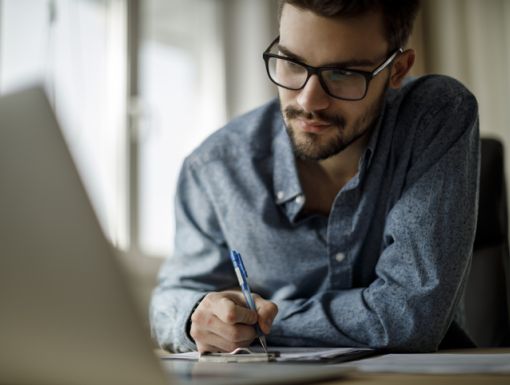 Man Looking at C Omputer