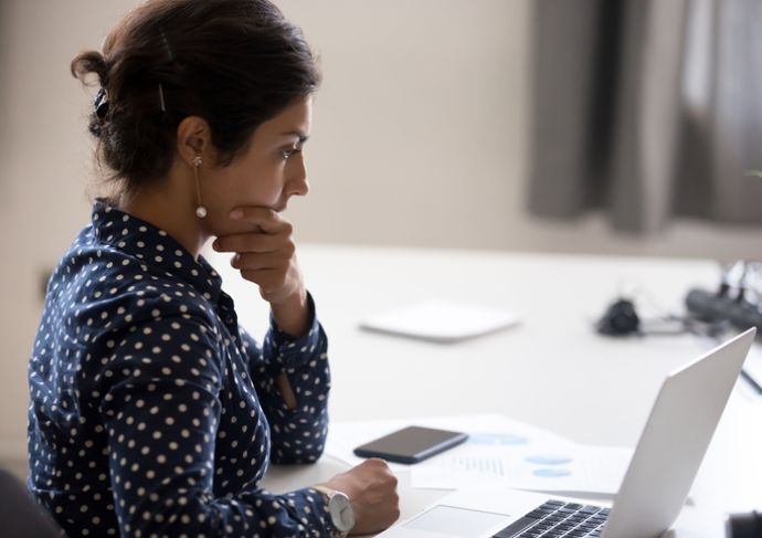 Woman searching on her laptop