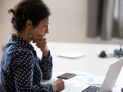 Woman searching on her laptop